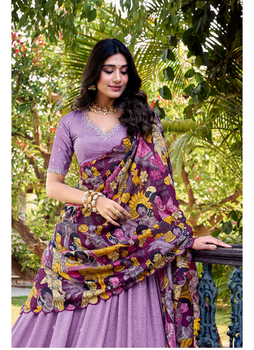 Alluring Lavender SIlk lehenga choli with sequin embrodiery and kalamkari print border.